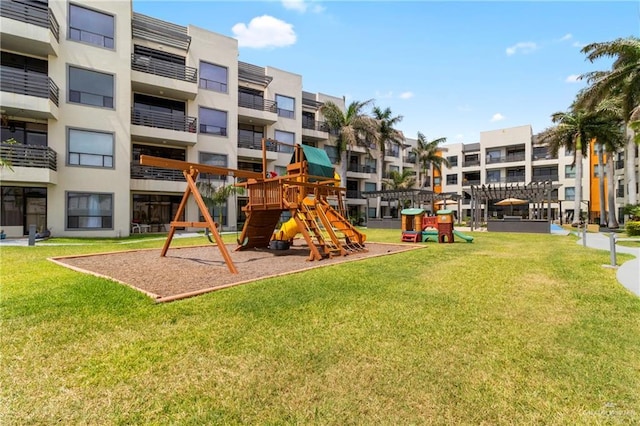 813 Travis St Unit 214, Mission, TX 78572 - community jungle gym featuring a yard and a residential view