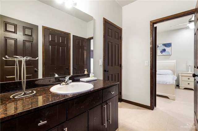 813 Travis St Unit 214, Mission, TX 78572 - bathroom featuring ensuite bathroom, vanity, baseboards, and tile patterned floors