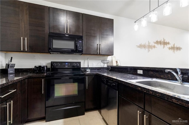 813 Travis St Unit 214, Mission, TX 78572 - kitchen featuring black appliances, dark stone countertops, dark brown cabinetry, a sink, and light tile patterned flooring