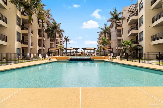 813 Travis St Unit 214, Mission, TX 78572 - community pool featuring fence