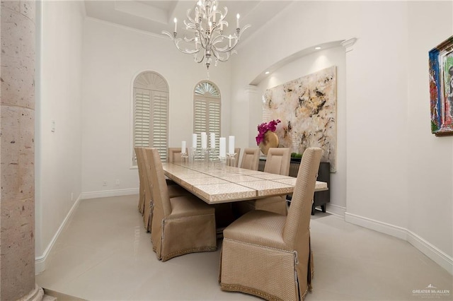 dining room featuring a notable chandelier and crown molding