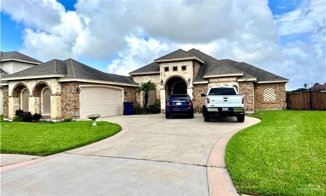 view of front of house featuring a garage and a front lawn