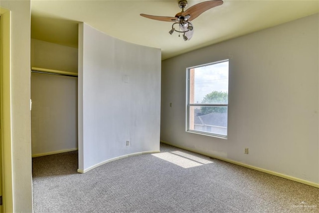 unfurnished bedroom with carpet floors, a closet, and ceiling fan