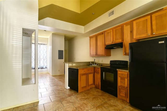 kitchen featuring electric panel, sink, light tile patterned flooring, and black appliances