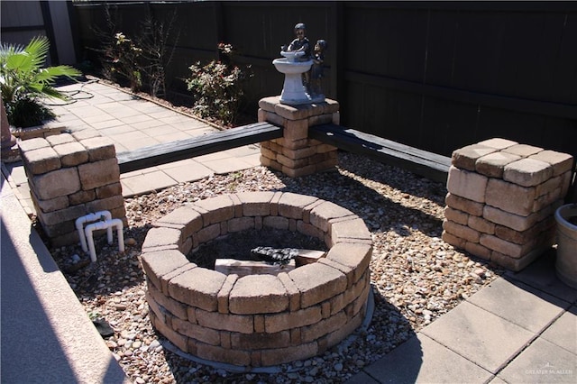 view of patio / terrace with a fire pit