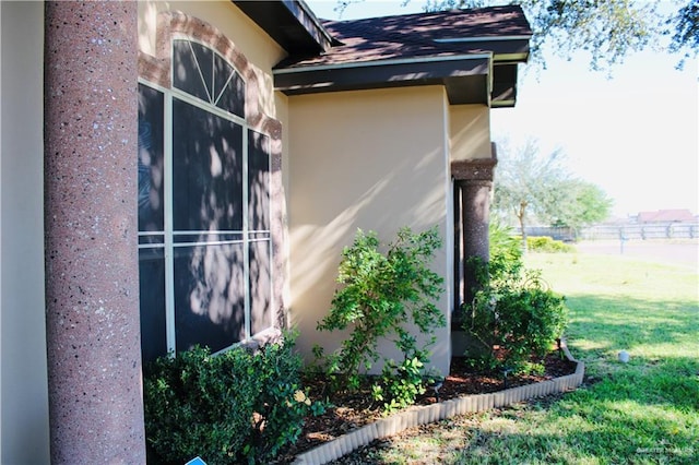 view of property exterior with a yard