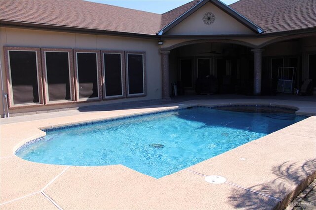 view of swimming pool with a patio area