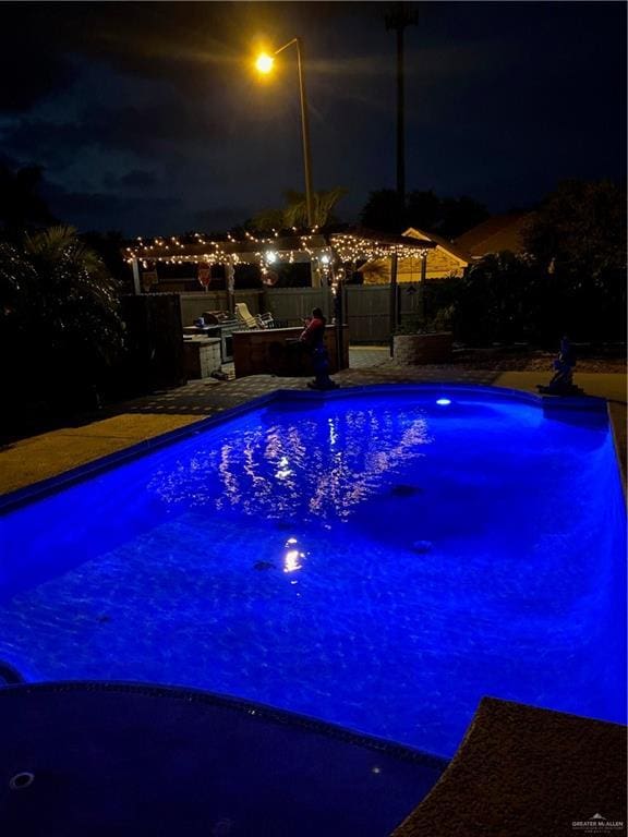 2712 Cornell Ave, Mcallen, TX 78504 - pool at twilight with area for grilling and an outdoor pool