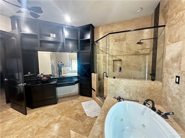 bathroom featuring shower with separate bathtub and vanity