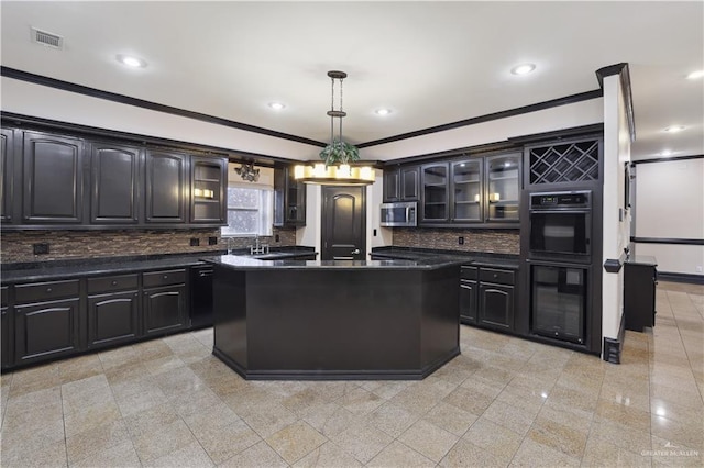 2712 Cornell Ave, Mcallen, TX 78504 - kitchen with visible vents, ornamental molding, decorative backsplash, dark countertops, and stainless steel microwave