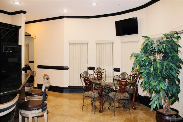 dining area featuring ornamental molding