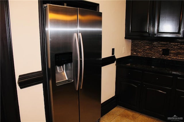 kitchen with decorative backsplash and stainless steel refrigerator with ice dispenser