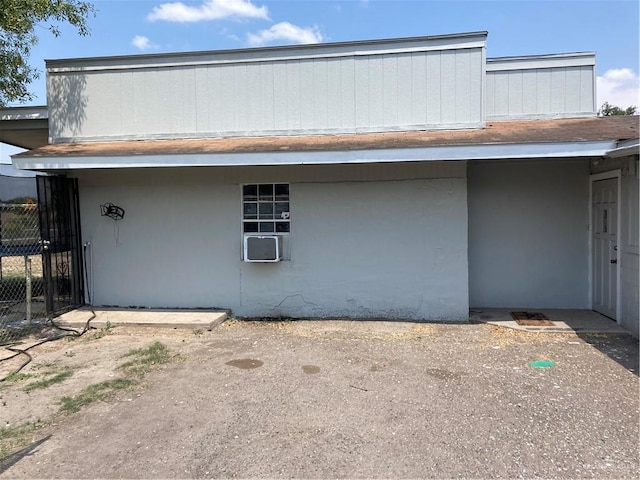 602 E Kelly Ave E, Pharr, TX 78577 - view of side of home featuring cooling unit and stucco siding