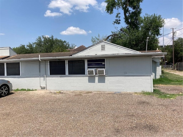 602 E Kelly Ave E, Pharr, TX 78577 - view of side of home with concrete block siding