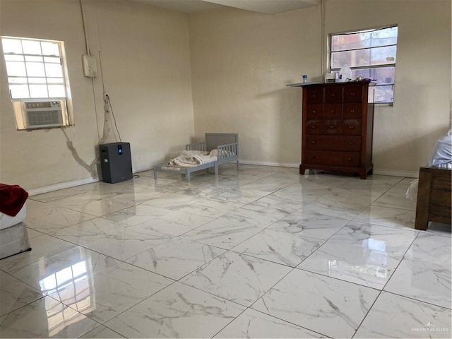 602 E Kelly Ave E, Pharr, TX 78577 - living area featuring marble finish flooring, plenty of natural light, cooling unit, and baseboards