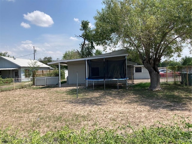 602 E Kelly Ave E, Pharr, TX 78577 - rear view of property featuring a trampoline
