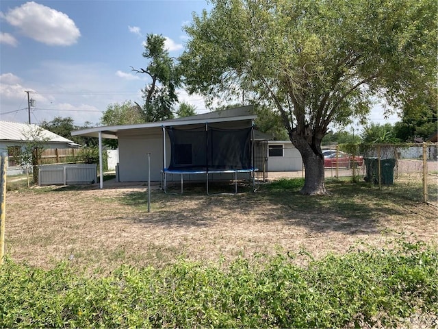 602 E Kelly Ave E, Pharr, TX 78577 - back of property featuring a trampoline