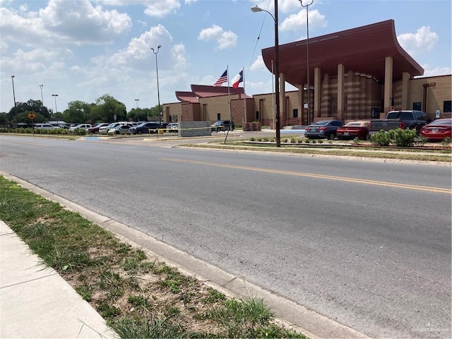 602 E Kelly Ave E, Pharr, TX 78577 - view of asphalt street with curbs, sidewalks, and street lighting