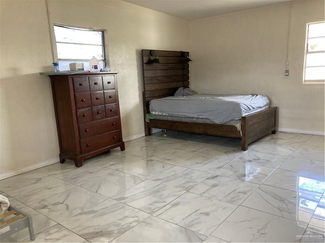 602 E Kelly Ave E, Pharr, TX 78577 - bedroom with light marble finish floors and baseboards