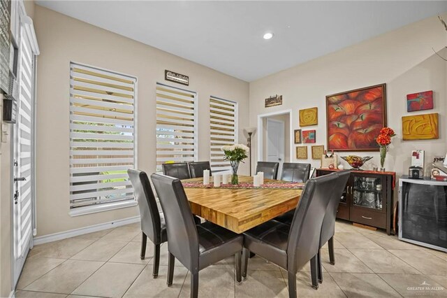 dining area featuring light tile patterned flooring