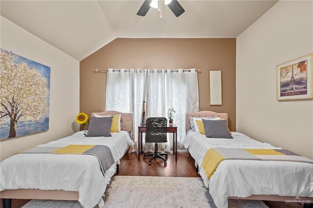 bedroom featuring dark hardwood / wood-style flooring, ceiling fan, and lofted ceiling