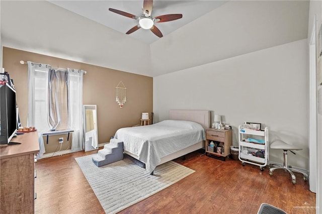 bedroom featuring vaulted ceiling, ceiling fan, and dark hardwood / wood-style floors