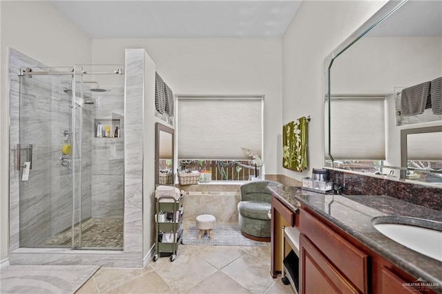 bathroom featuring tile patterned flooring, vanity, and an enclosed shower