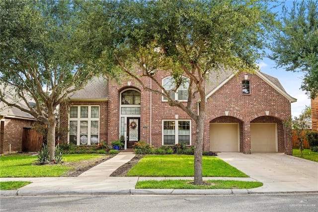 view of front facade with a garage and a front yard