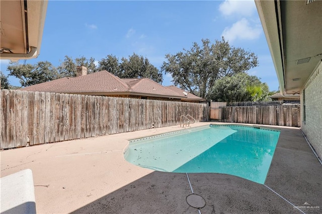 view of swimming pool with a fenced in pool, a patio area, and a fenced backyard