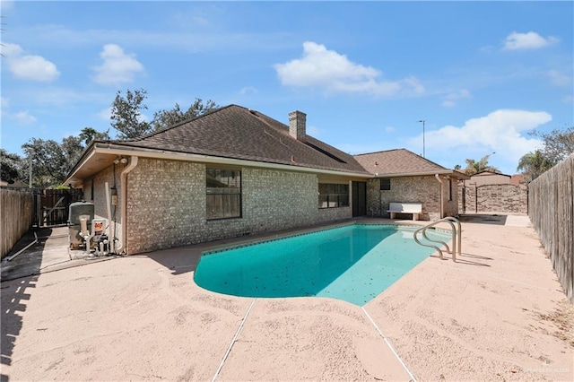 view of pool featuring a patio area, a fenced backyard, and a fenced in pool