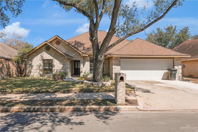 view of front facade featuring a garage, concrete driveway, and brick siding