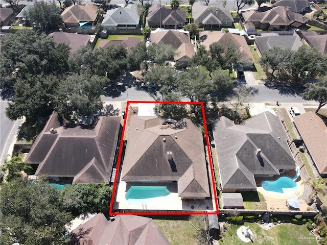 birds eye view of property with a residential view