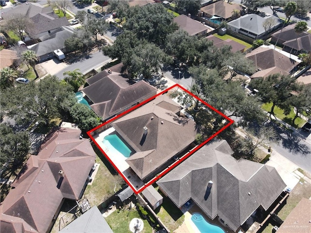 birds eye view of property with a residential view