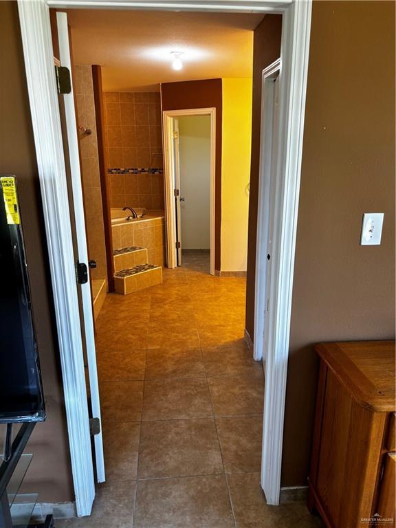21732 Mile 17 Rd, Edinburg, TX 78541 - corridor with tile patterned flooring
