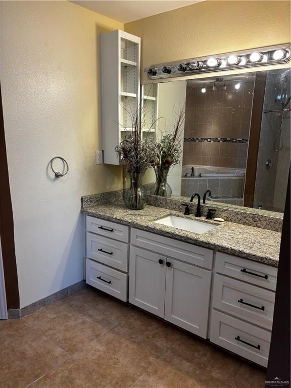21732 Mile 17 Rd, Edinburg, TX 78541 - bathroom featuring baseboards, a textured wall, and vanity