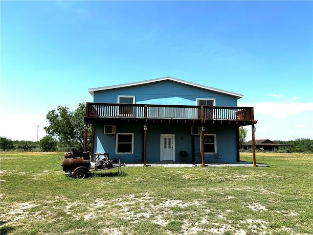 21732 Mile 17 Rd, Edinburg, TX 78541 - rear view of property featuring a lawn, a deck, and stucco siding