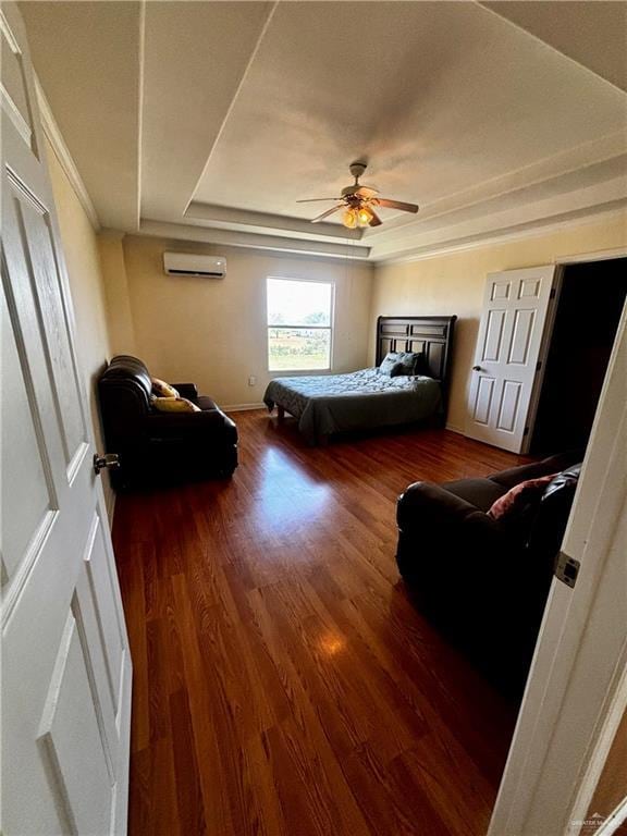 21732 Mile 17 Rd, Edinburg, TX 78541 - bedroom featuring wood finished floors, a ceiling fan, a raised ceiling, and a wall mounted AC