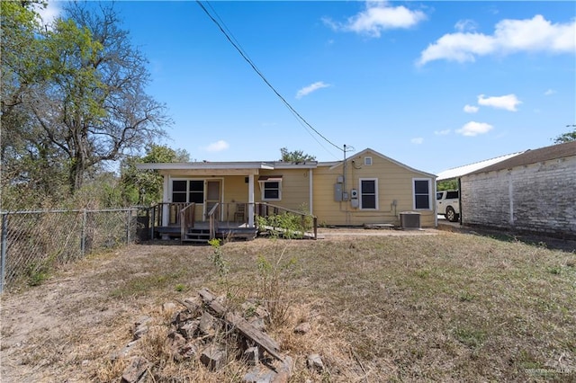 615 Iowa St, Mercedes, TX 78570 - back of house with cooling unit and fence