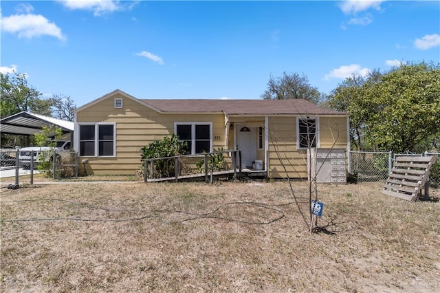 615 Iowa St, Mercedes, TX 78570 - view of front of house featuring a gate, fence, and a detached carport