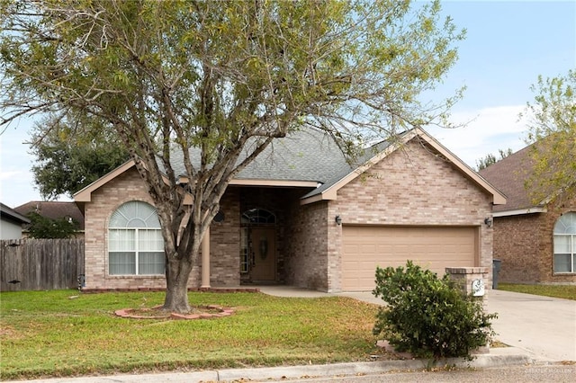 ranch-style home featuring a garage and a front yard