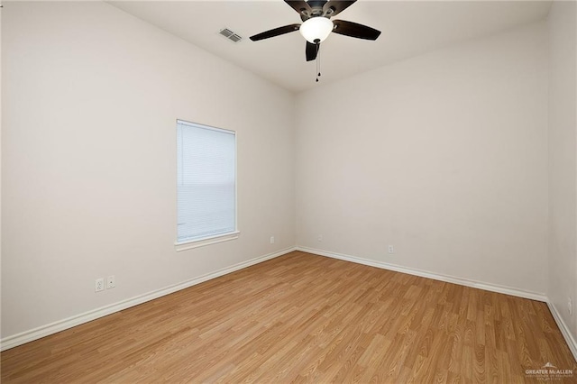 unfurnished room featuring light hardwood / wood-style flooring and ceiling fan