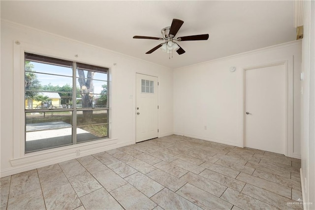 spare room featuring ceiling fan and ornamental molding