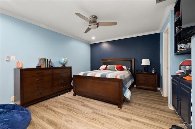 bedroom featuring light wood finished floors, a ceiling fan, and crown molding