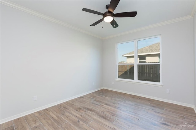 unfurnished room featuring crown molding, a ceiling fan, baseboards, and light wood-type flooring