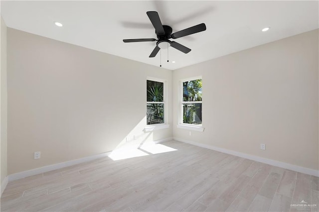 empty room with light hardwood / wood-style flooring and ceiling fan