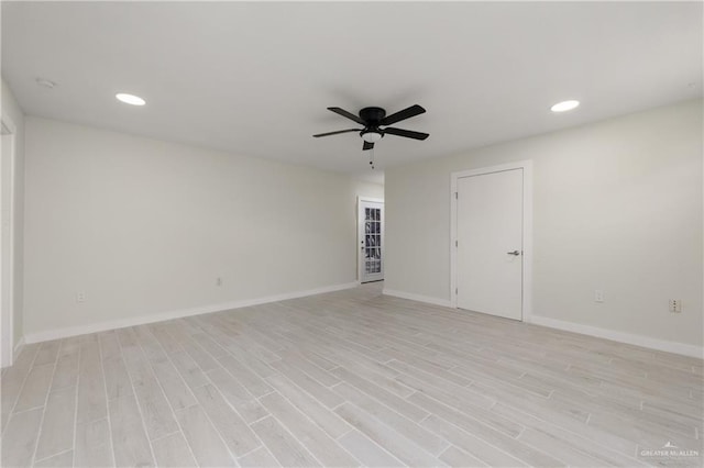 spare room with ceiling fan and light hardwood / wood-style flooring