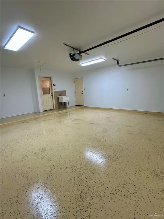 6200 N Cynthia St, Mcallen, TX 78504 - garage featuring a garage door opener and baseboards