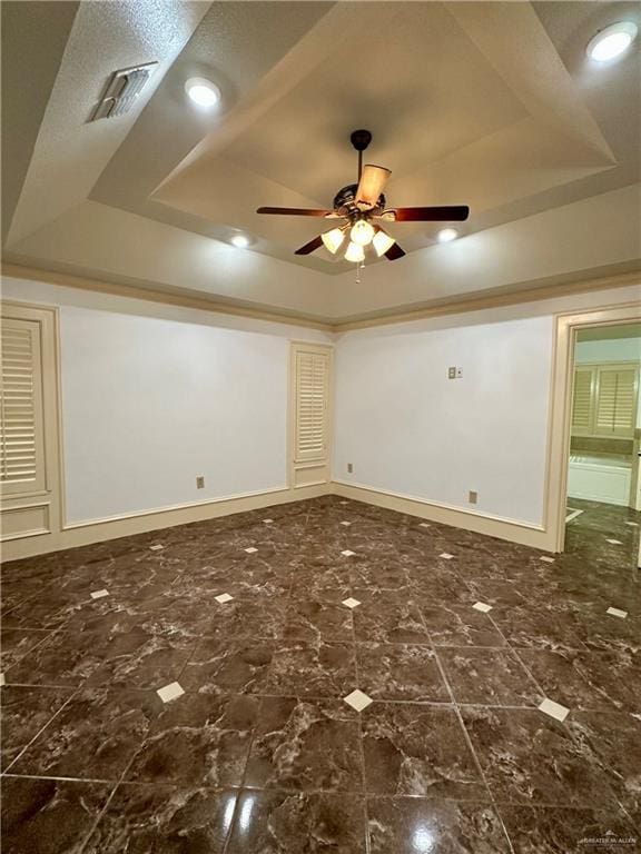 6200 N Cynthia St, Mcallen, TX 78504 - empty room featuring a raised ceiling, ceiling fan, and recessed lighting