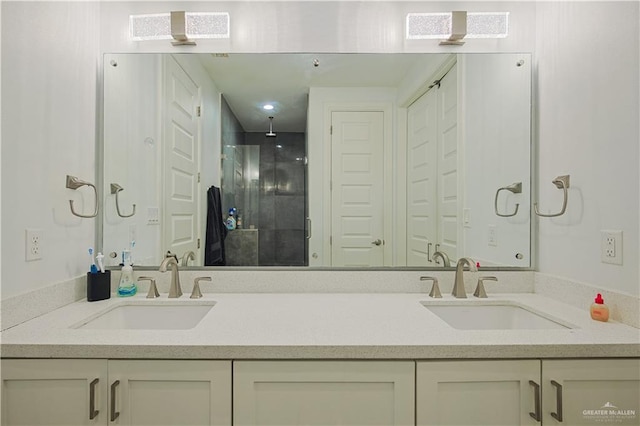 full bathroom with a sink, visible vents, and a shower stall