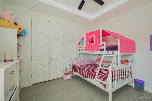 bedroom with baseboards, ceiling fan, and wood finished floors